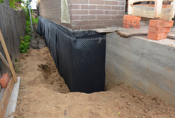 SJ Waterproofing Pros technician performing targeted Wet Basement Repair assessment in Shelbyville, KY
